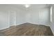 Bright bedroom with hardwood floors and multiple closets at 413 Edison Rail Ln, Knightdale, NC 27545