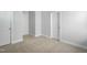 Bright bedroom featuring neutral carpeting, white trim, and fresh, neutral paint at 413 Edison Rail Ln, Knightdale, NC 27545