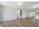 Open-concept living area with staircase, leading into the kitchen area at 413 Edison Rail Ln, Knightdale, NC 27545