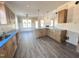 A spacious kitchen offers wood cabinets, a central island, and modern lighting at 105 Roma Gora Ct, Princeton, NC 27569