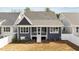 Private backyard featuring sod, landscaping and a white privacy fence at 416 S Cross St, Youngsville, NC 27596