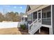 New back porch with privacy screen overlooking the landscaped yard at 416 S Cross St, Youngsville, NC 27596