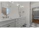 Bright bathroom with double vanity and modern fixtures at 416 S Cross St, Youngsville, NC 27596