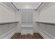 Walk-in closet with custom shelving provides ample storage at 416 S Cross St, Youngsville, NC 27596