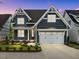 Stunning two-story home with a modern exterior and a well-maintained front yard at 416 S Cross St, Youngsville, NC 27596