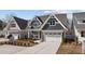 Charming home with a two-car garage and landscaped front yard, enhancing curb appeal at 416 S Cross St, Youngsville, NC 27596