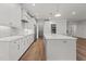 Bright kitchen featuring a center island and modern appliances at 416 S Cross St, Youngsville, NC 27596