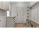 Inviting mudroom with built-in storage, bench, hooks, and natural wood accents that create an organized and stylish transition at 416 S Cross St, Youngsville, NC 27596