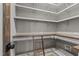 Walk-in pantry featuring wood countertops and a ladder for easy access to shelves at 416 S Cross St, Youngsville, NC 27596