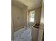 Modern bathroom features stylish marble floors and a bathtub next to a bright window at 103 Slocum Dr, Wendell, NC 27591