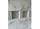 Bathroom shower featuring elegant marble tiles, mosaic accents, and built-in niches at 103 Slocum Dr, Wendell, NC 27591