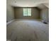 Spacious bedroom with light-filled windows with neutral color walls and trim at 103 Slocum Dr, Wendell, NC 27591