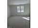 Unfinished bedroom with ample natural light from large windows, perfect for creating a bright and airy space at 103 Slocum Dr, Wendell, NC 27591