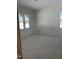 Bright unfinished bedroom with several windows, ready to be transformed into a cozy and inviting living space at 103 Slocum Dr, Wendell, NC 27591