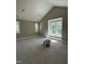 Large bonus room with high ceilings, bright windows, and a cozy window seat at 103 Slocum Dr, Wendell, NC 27591