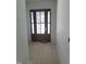 Front entryway featuring a dark wood door with frosted glass inserts, adding style and privacy at 103 Slocum Dr, Wendell, NC 27591