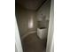 Small laundry room with storage cabinets and laundry sink at 103 Slocum Dr, Wendell, NC 27591