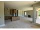 Open living area with a fireplace, built-in shelving, and access to an outdoor deck at 103 Slocum Dr, Wendell, NC 27591