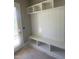 Mudroom boasts built-in shelving and bench seating, with a convenient exterior door at 103 Slocum Dr, Wendell, NC 27591