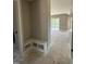 Mudroom with convenient built-in bench seating and shelving for organized storage at 103 Slocum Dr, Wendell, NC 27591