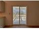 Sliding glass doors open to a back porch with great outdoor views at 168 Grand Griffon Way, Lillington, NC 27546