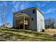 Spacious wooden deck in the backyard of a two-story home, with a view of the lawn at 168 Grand Griffon Way, Lillington, NC 27546