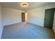 Spacious bedroom with neutral carpet and a bright light fixture at 168 Grand Griffon Way, Lillington, NC 27546