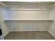 Walk-in closet with carpeted flooring, rod, and built-in shelving at 168 Grand Griffon Way, Lillington, NC 27546