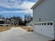 A long driveway with a new house in the distance at 168 Grand Griffon Way, Lillington, NC 27546