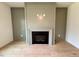 Close up of a neutral painted fireplace with a dark metal firebox at 168 Grand Griffon Way, Lillington, NC 27546