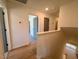 Upstairs landing of a neutral-painted home with hardwood floors at 168 Grand Griffon Way, Lillington, NC 27546