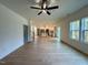 Open-concept living room and kitchen boasts hardwood floors and stainless appliances at 168 Grand Griffon Way, Lillington, NC 27546