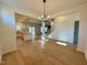 Open-concept living space and kitchen boasts hardwood floors at 168 Grand Griffon Way, Lillington, NC 27546