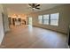 Open floor plan featuring hardwood floors, neutral walls, and stainless steel appliances at 168 Grand Griffon Way, Lillington, NC 27546