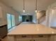 Open floor plan of living room with fireplace extending from quartz kitchen island at 168 Grand Griffon Way, Lillington, NC 27546