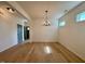 Beautiful open-concept living room with hardwood floors and modern lighting at 168 Grand Griffon Way, Lillington, NC 27546