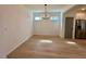 Open-concept living room boasts hardwood floors and lots of light at 168 Grand Griffon Way, Lillington, NC 27546