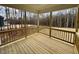 A relaxing outdoor porch with wooden floors and forest views at 168 Grand Griffon Way, Lillington, NC 27546