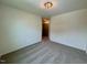 Spacious bedroom featuring carpet flooring, white walls and a ceiling light at 196 Grand Griffon Way, Lillington, NC 27546