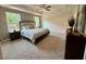 Spacious primary bedroom boasts neutral decor, a tray ceiling and soft, natural light at 196 Grand Griffon Way, Lillington, NC 27546