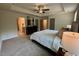 Large primary bedroom boasts neutral decor and flows seamlessly to the en suite bathroom at 196 Grand Griffon Way, Lillington, NC 27546