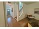 Inviting foyer with hardwood floors and staircase that leads to the upper level at 196 Grand Griffon Way, Lillington, NC 27546