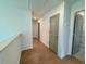 Bright hallway featuring hardwood floors, neutral walls, and modern doors at 196 Grand Griffon Way, Lillington, NC 27546