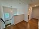 Upstairs hallway with hardwood floors leading to bedrooms and bathrooms at 196 Grand Griffon Way, Lillington, NC 27546
