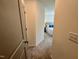 Hallway leads to a bedroom with a neutral color palette at 196 Grand Griffon Way, Lillington, NC 27546