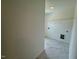Bright laundry room featuring stylish tile floors and wire shelving at 196 Grand Griffon Way, Lillington, NC 27546