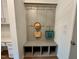 Convenient mudroom with hooks, bench, and storage cubbies, perfect for entry organization at 196 Grand Griffon Way, Lillington, NC 27546