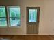 View from inside porch to screened in porch with door and window at 196 Grand Griffon Way, Lillington, NC 27546
