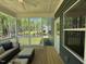 Spacious screened porch with outdoor seating and private backyard view at 196 Grand Griffon Way, Lillington, NC 27546