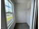 Bright walk-in closet with carpet flooring, wire shelving and a window with a view of the neighborhood at 196 Grand Griffon Way, Lillington, NC 27546
